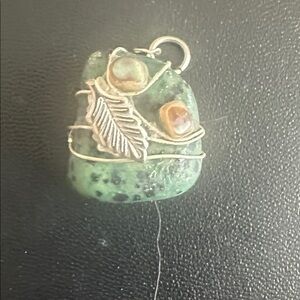 Turquoise stone wire wrapped in silver